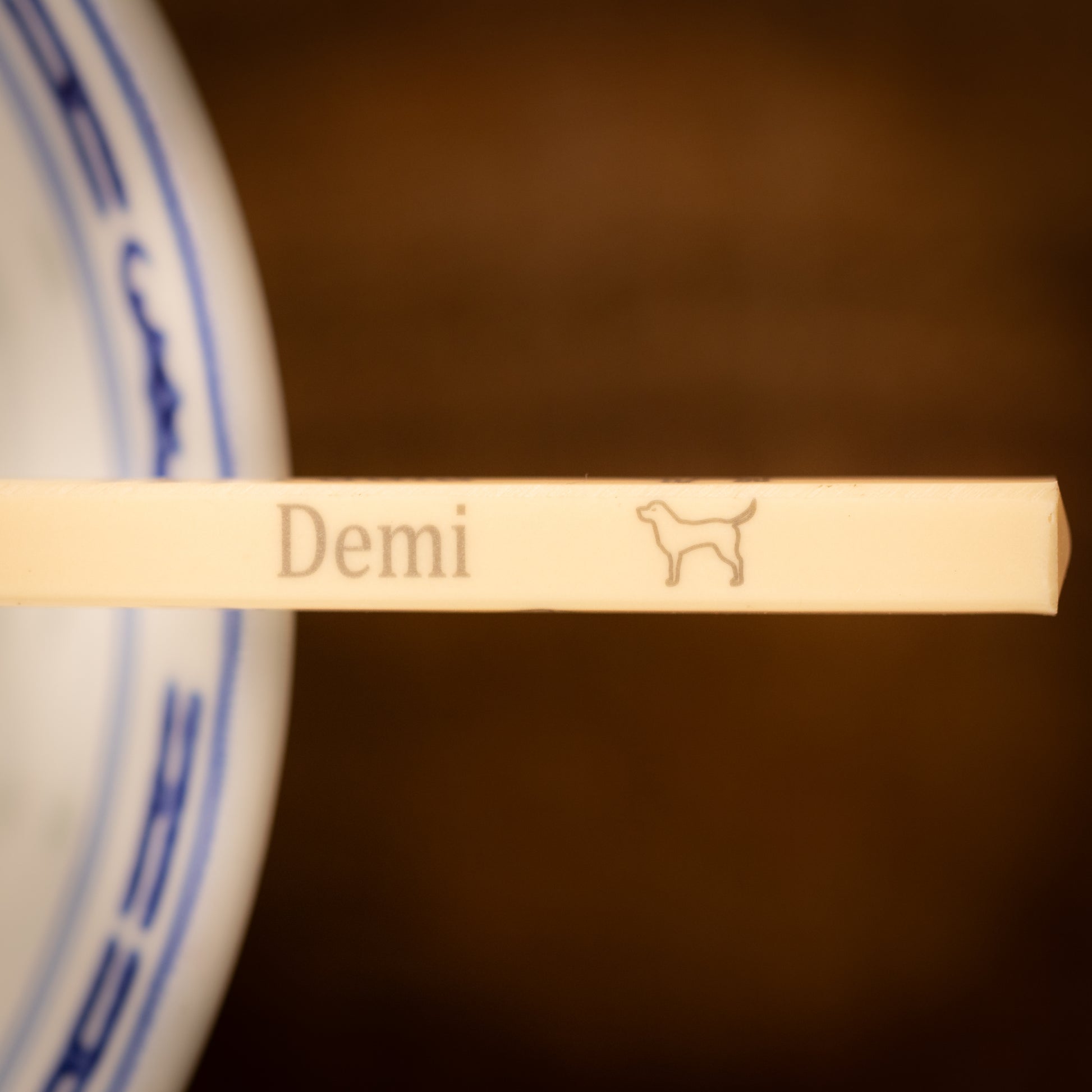 Cream coloured plastic melamine personalised chopsticks engraved with a name and Chinese Zodiac Animal, The Year of the Dog.