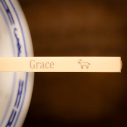 Cream coloured plastic melamine personalised chopsticks engraved with a name and Chinese Zodiac Animal, The Year of the Goat.