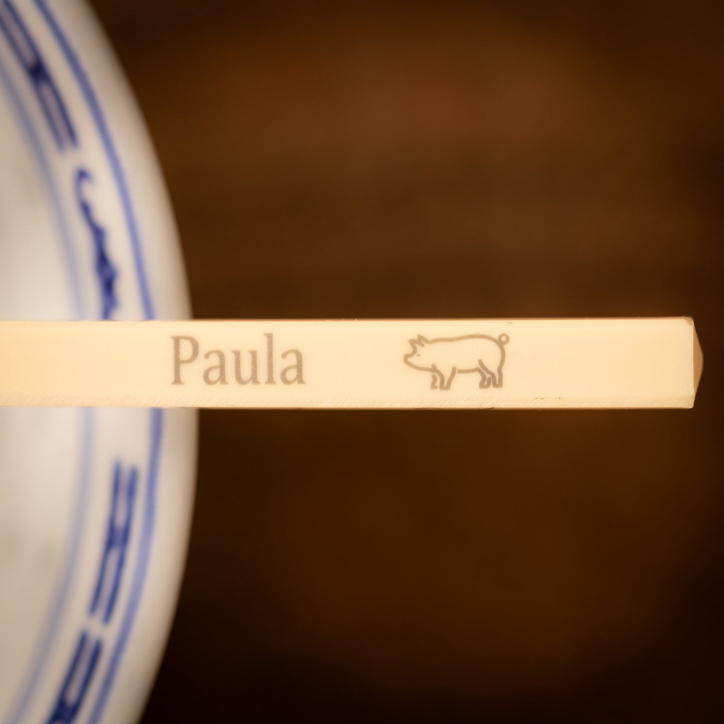 Cream coloured plastic melamine personalised chopsticks engraved with a name and Chinese Zodiac Animal, The Year of the Pig.