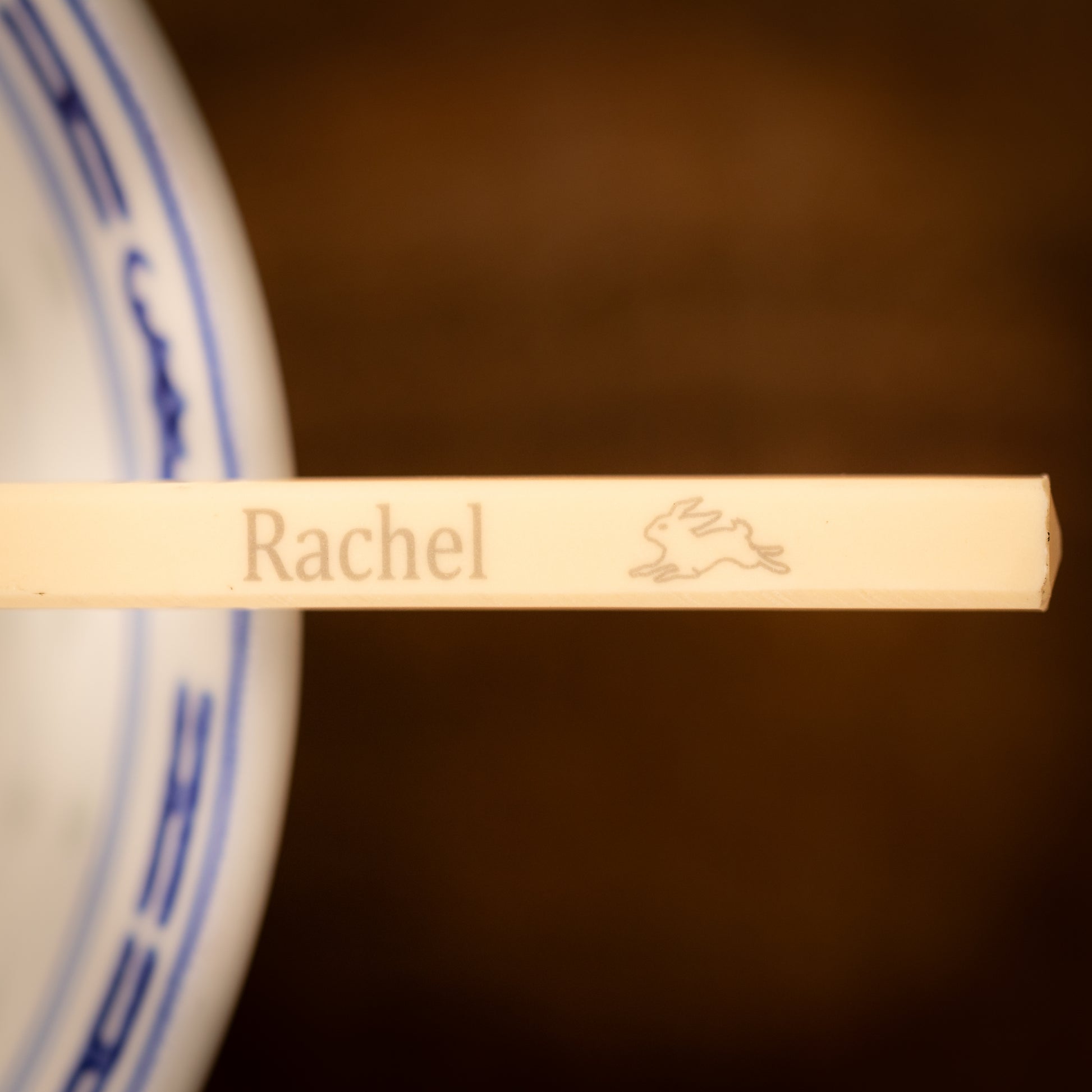 Cream coloured plastic melamine personalised chopsticks engraved with a name and Chinese Zodiac Animal, The Year of the Rabbit.