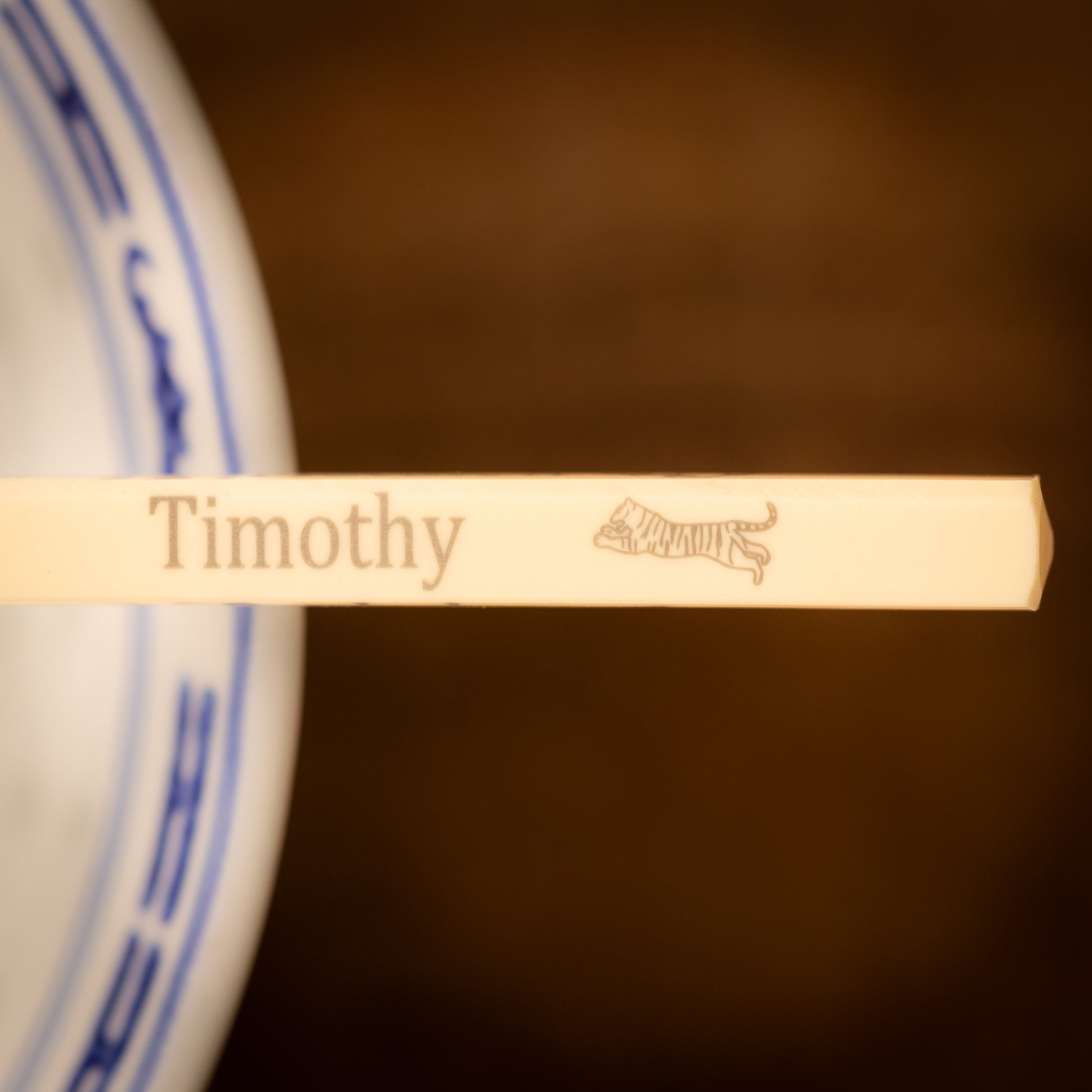 Cream coloured plastic melamine personalised chopsticks engraved with a name and Chinese Zodiac Animal, The Year of the Tiger.