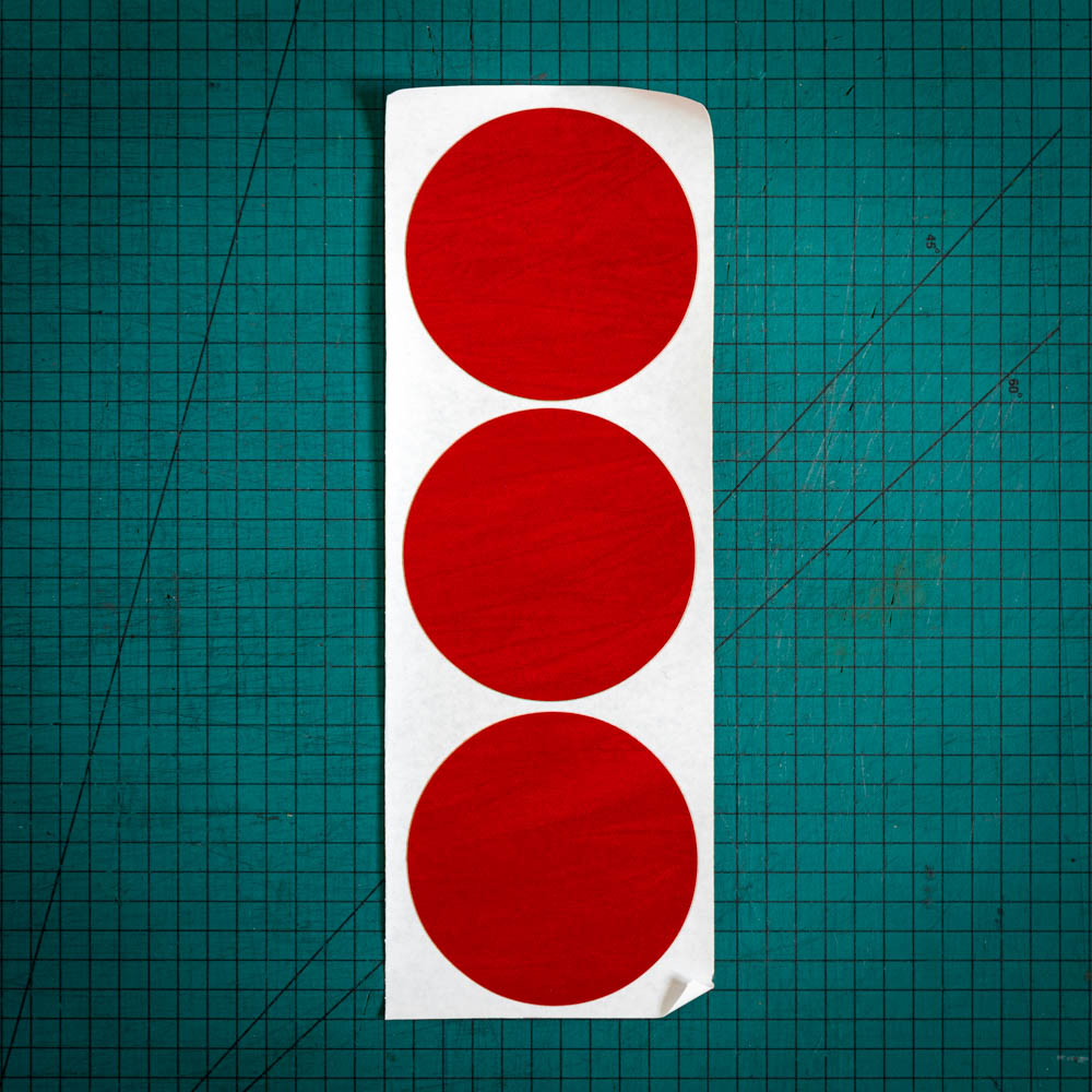 Red baize circles, sometimes known as felt, laser cut into three big circles