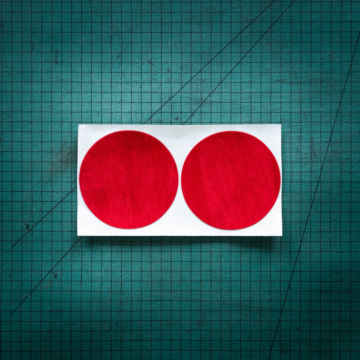 Red baize circles, sometimes known as felt, laser cut into circles