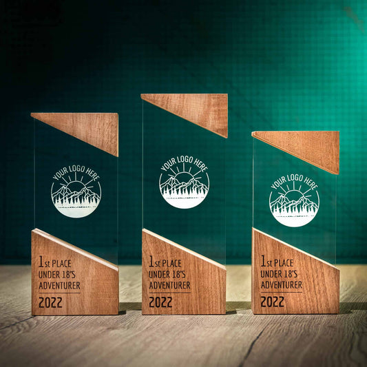Three Rise trophies, artistic personalised laser engraved perspex trophies with a wooden base