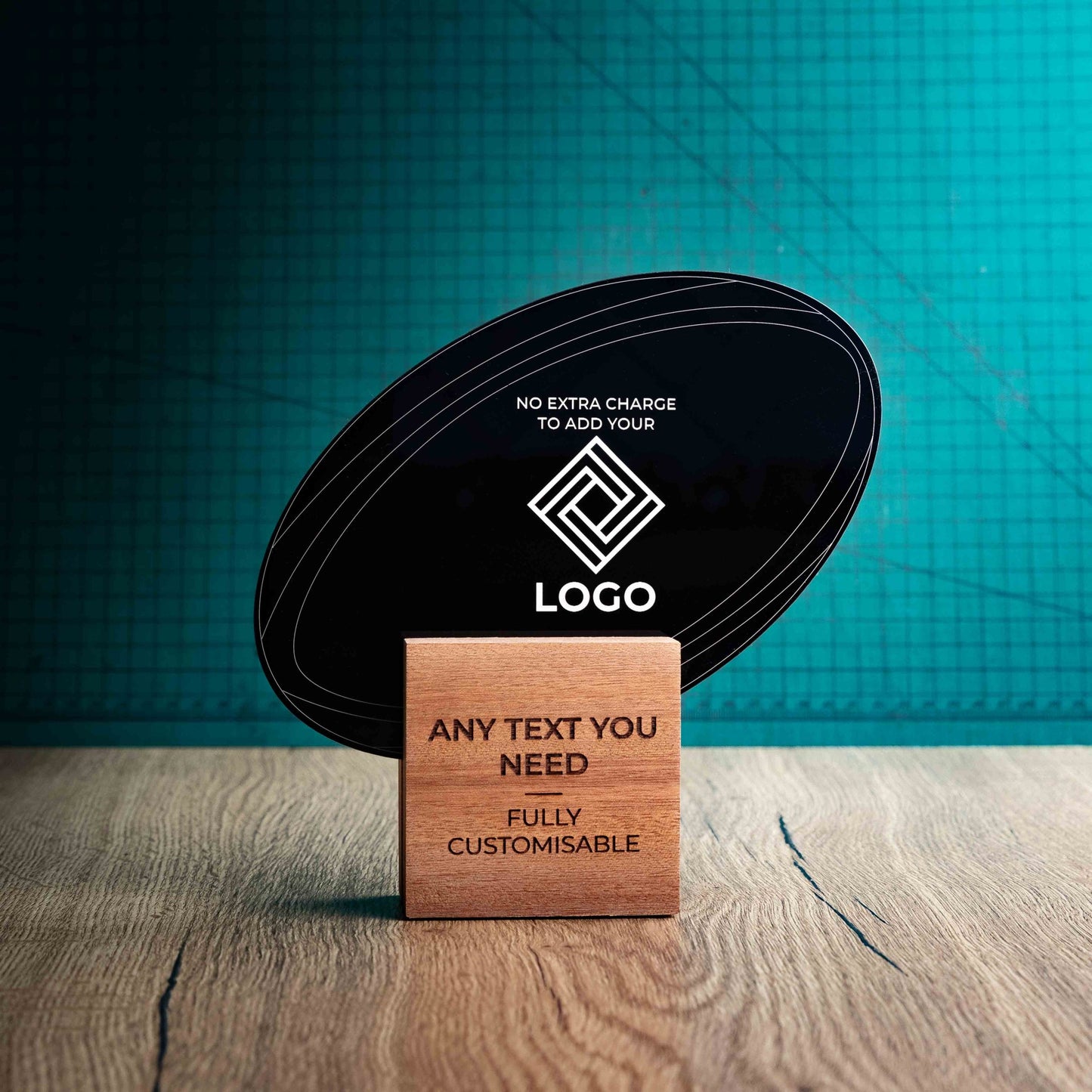 A medium rugby trophy with custom text and logos, on an eco-friendly wooden base, with a black Perspex rugby ball mounted on top, featuring fully customisable areas for text and logos.