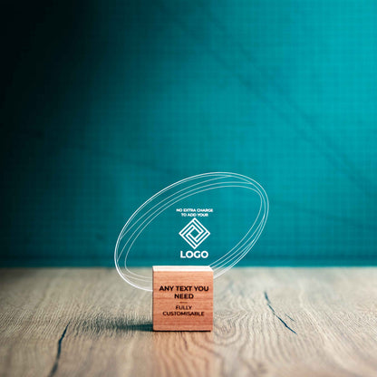 A small rugby trophy with custom text and logos, on an eco-friendly wooden base, with a clear Perspex rugby ball mounted on top, featuring fully customisable areas for text and logos.