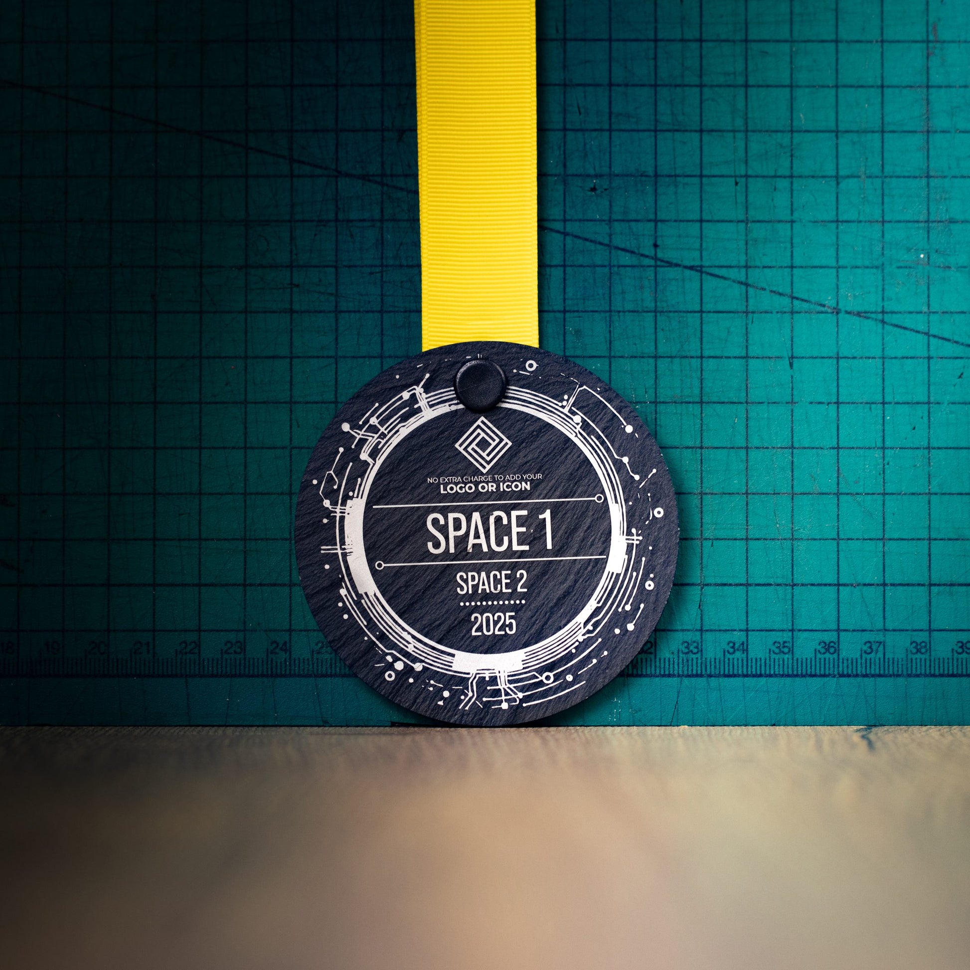 A personalised laser engraved Welsh slate sports medal