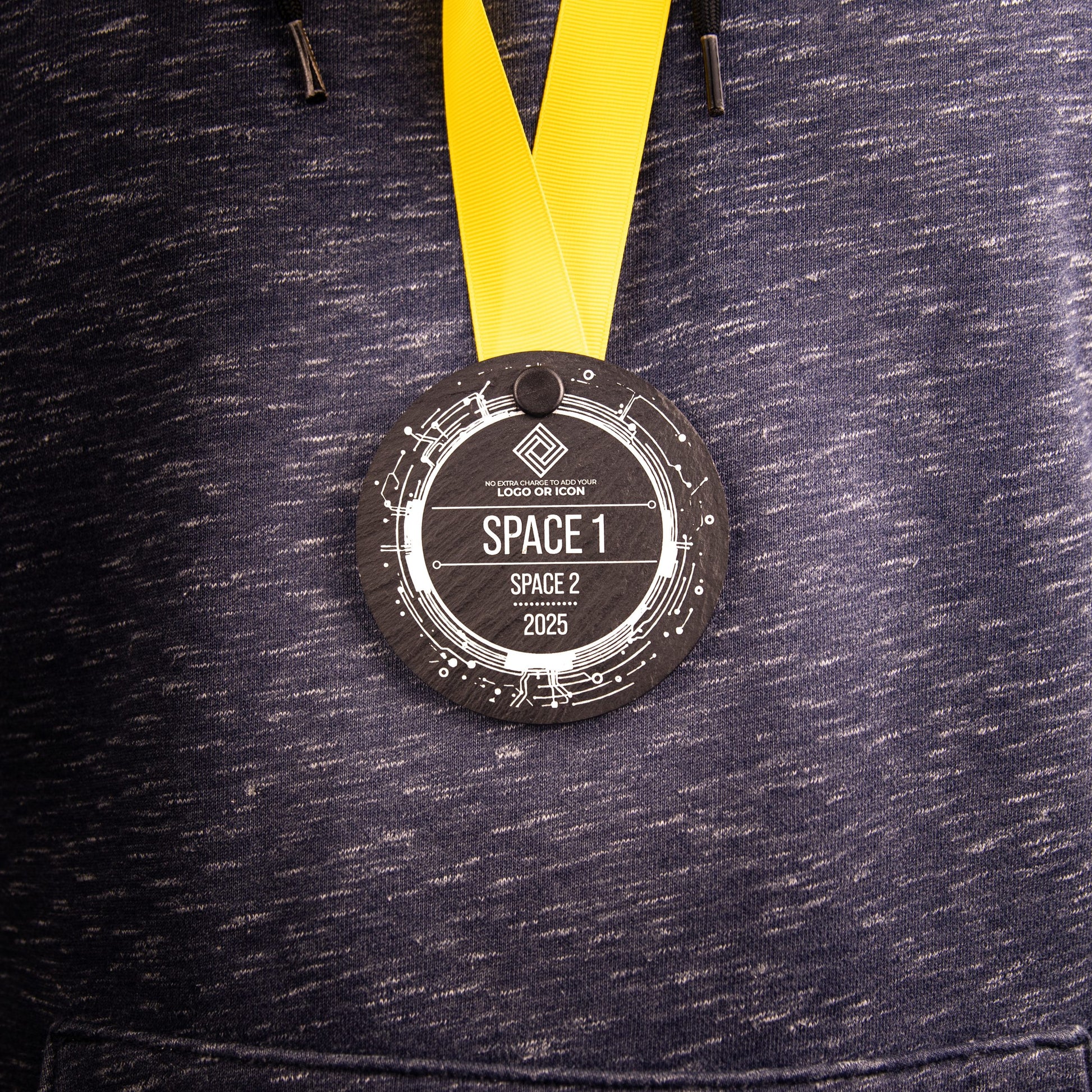 A personalised laser engraved Welsh slate sports medal