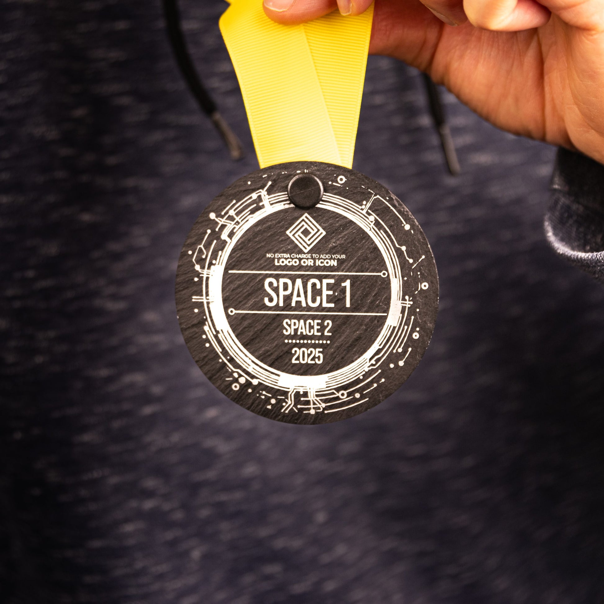 A personalised laser engraved Welsh slate sports medal