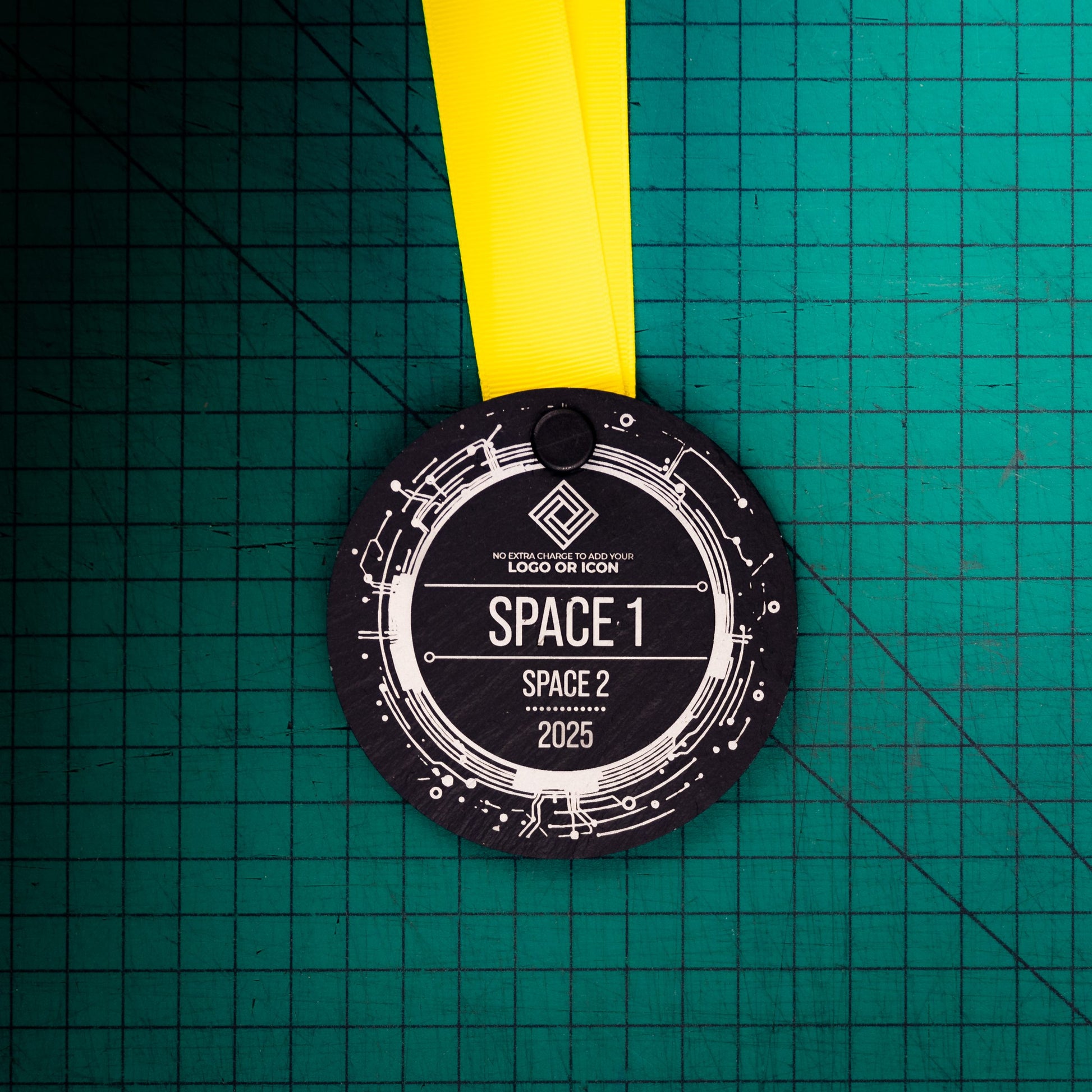 A personalised laser engraved Welsh slate sports medal
