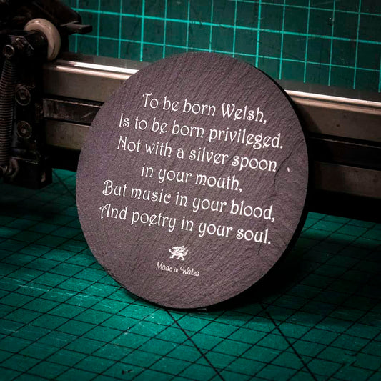A laser engraved Welsh slate coaster with a poem about being born welsh