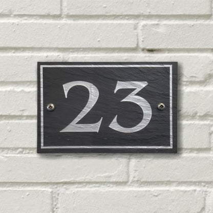 A rectangular Welsh Slate House Plaque with a color filled house number and boarder