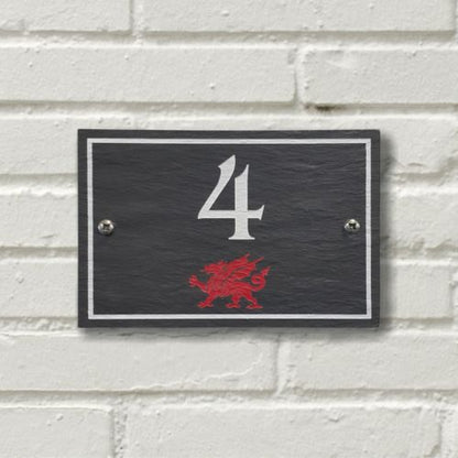 A rectangular Welsh Slate House Plaque with a color filled house number, welsh dragon and a boarder