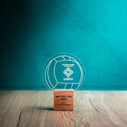A small Valleyball trophy with custom text and logos, on an eco-friendly wooden base, with a clear Perspex Volleyball mounted on top, featuring fully customisable areas for text and logos.