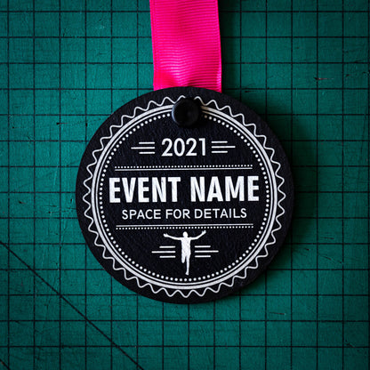 A personalised laser engraved Welsh slate sports medal