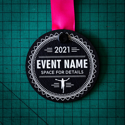 A personalised laser engraved Welsh slate sports medal