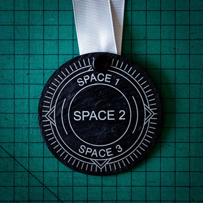 A personalised laser engraved Welsh slate sports medal