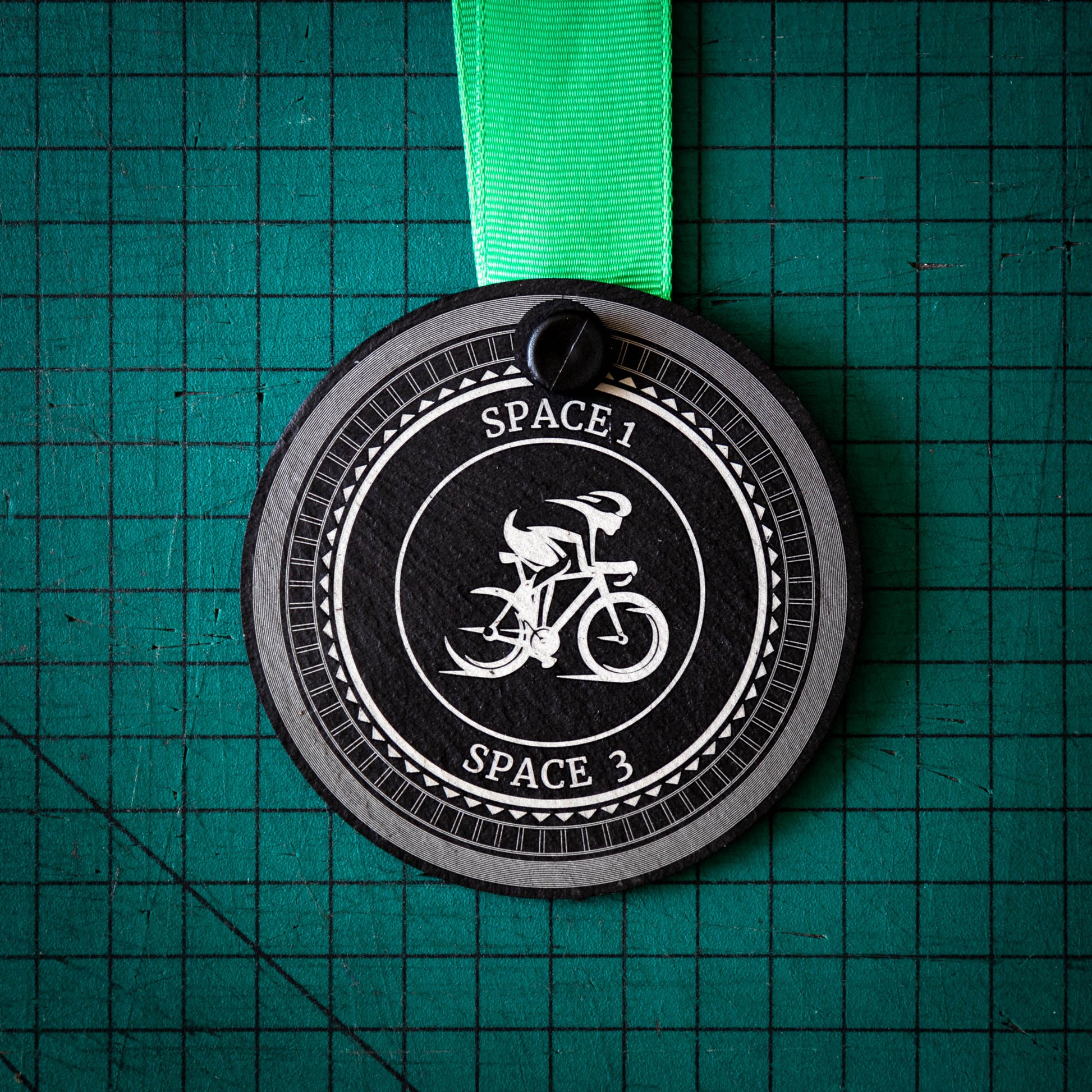 A personalised laser engraved Welsh slate sports medal