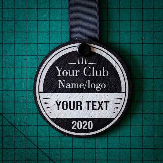 A personalised laser engraved Welsh slate running medal