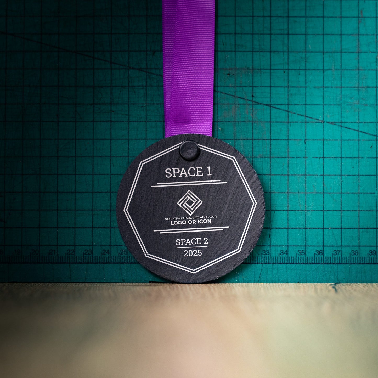 A personalised laser engraved Welsh slate sports medal