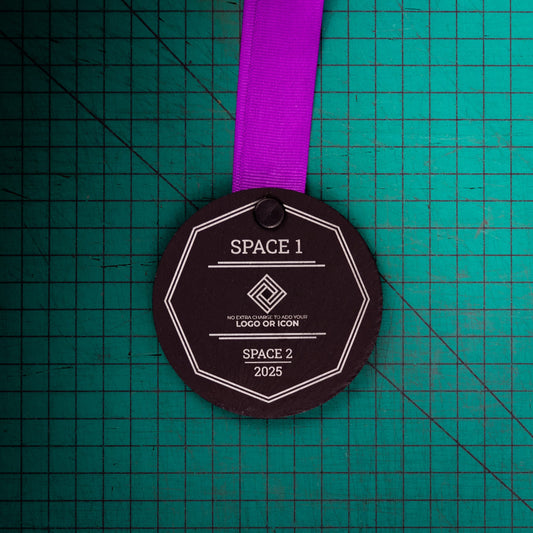 A personalised laser engraved Welsh slate sports medal