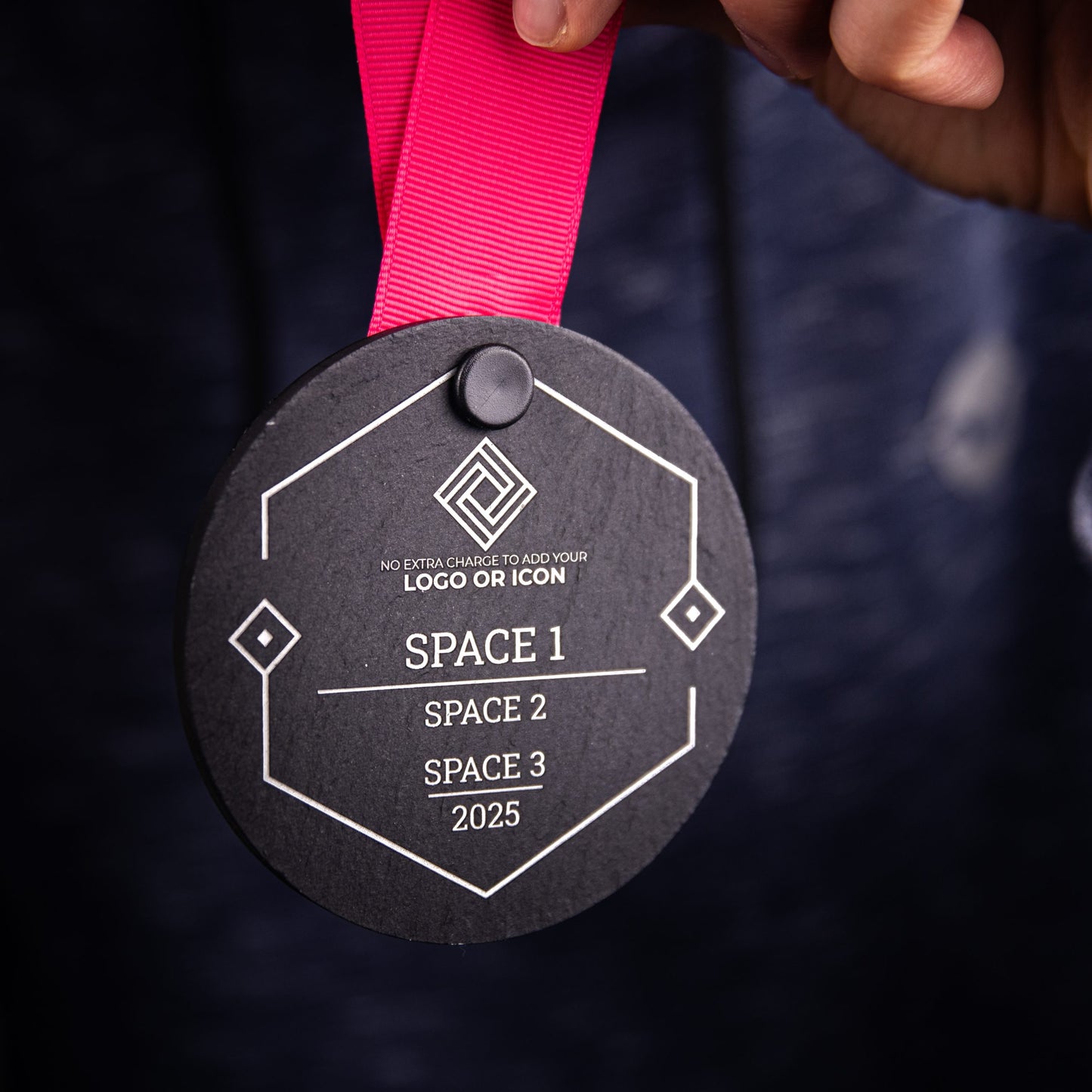 A personalised laser engraved Welsh slate sports medal