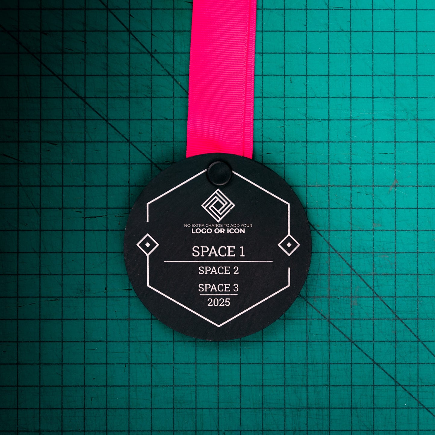 A personalised laser engraved Welsh slate sports medal