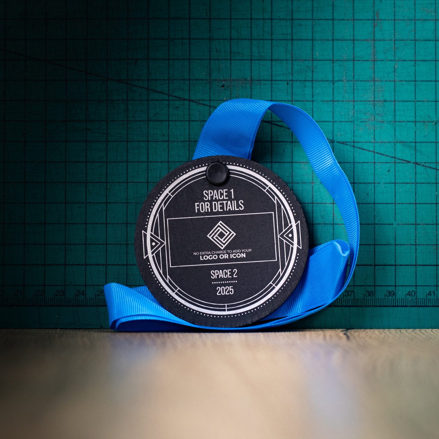 A personalised laser engraved Welsh slate sports medal