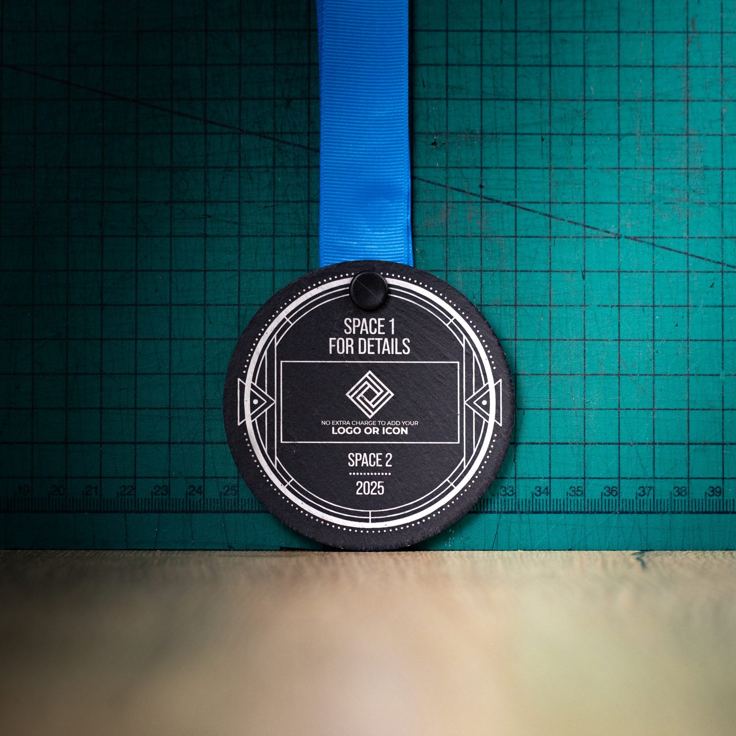 A personalised laser engraved Welsh slate sports medal
