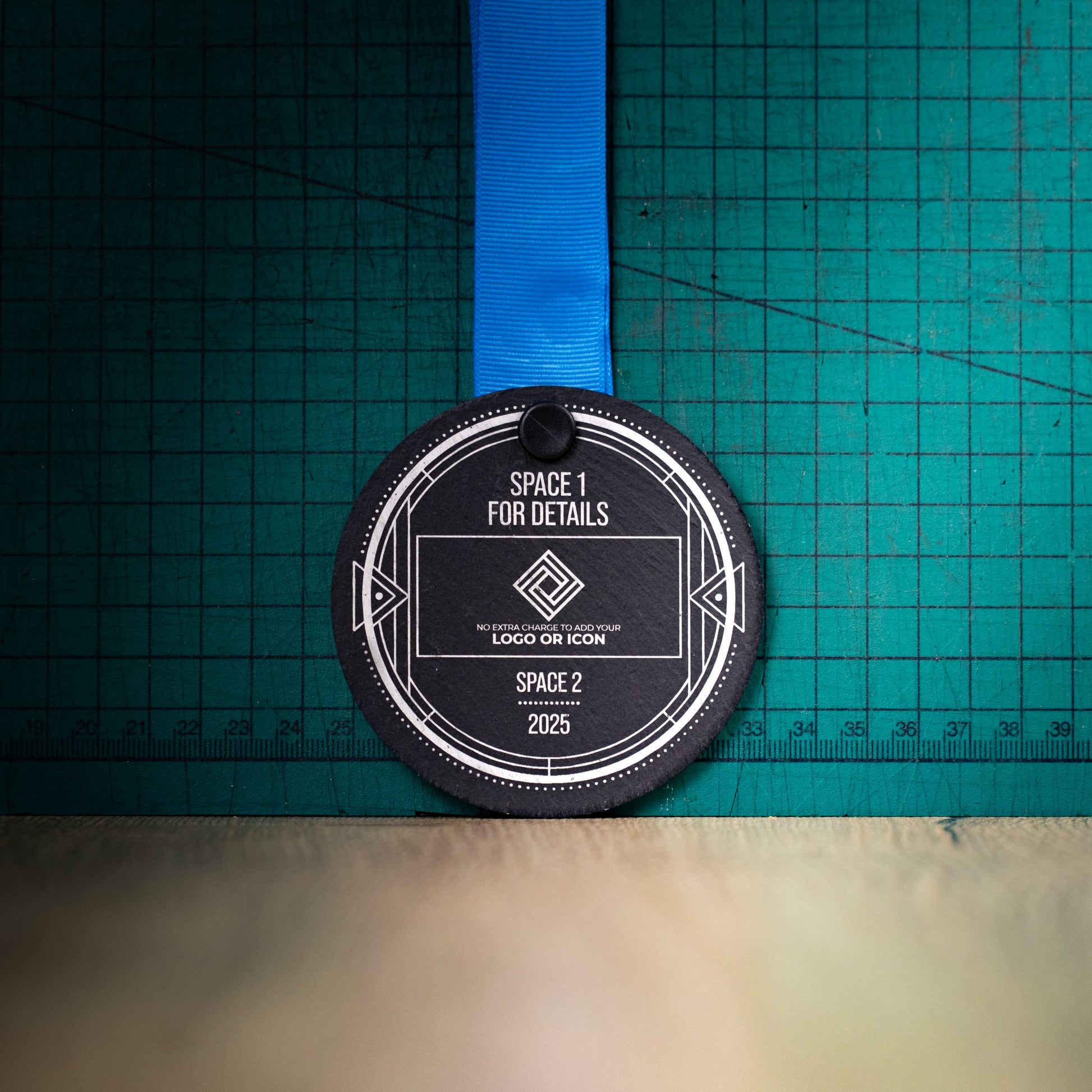 A personalised laser engraved Welsh slate sports medal