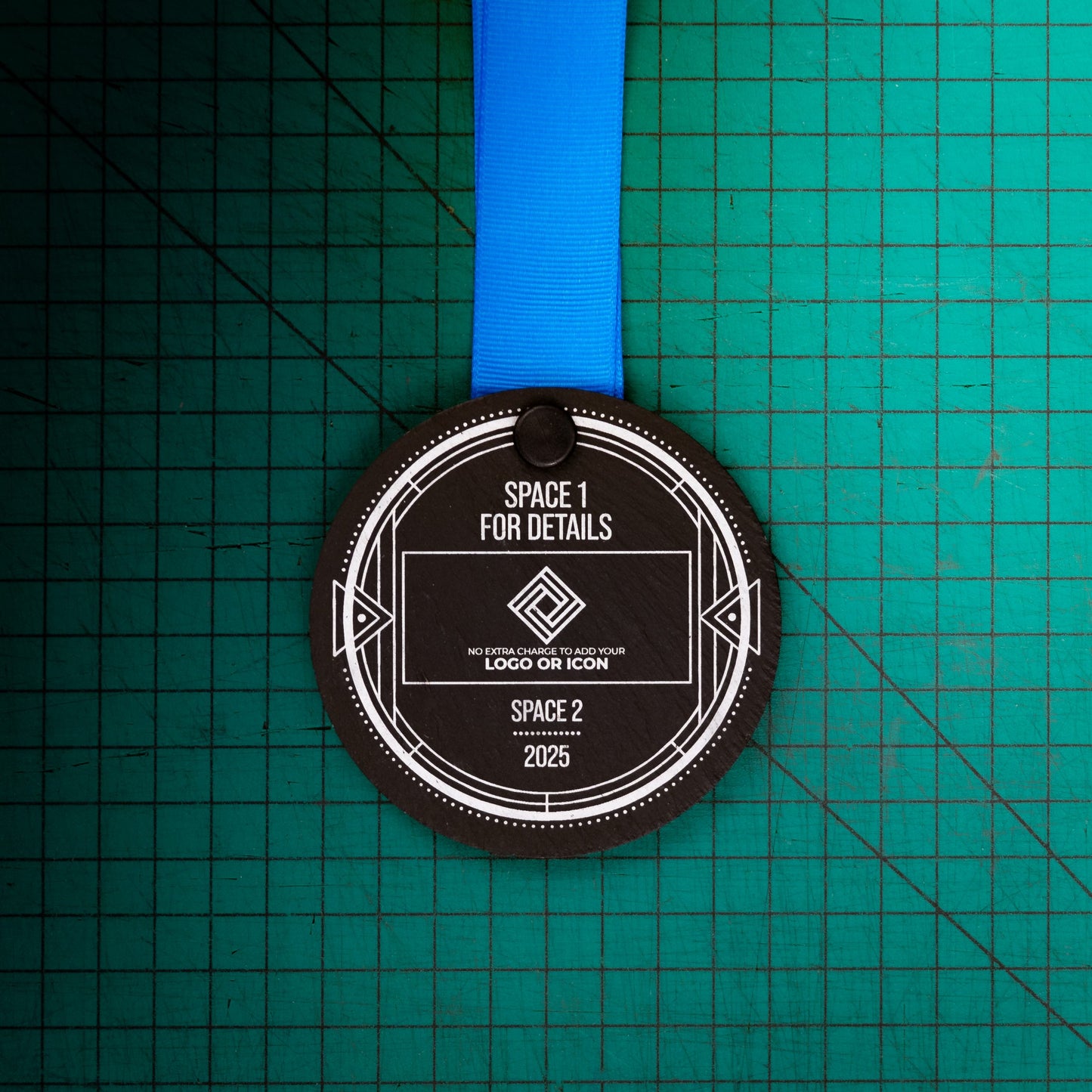 A personalised laser engraved Welsh slate sports medal