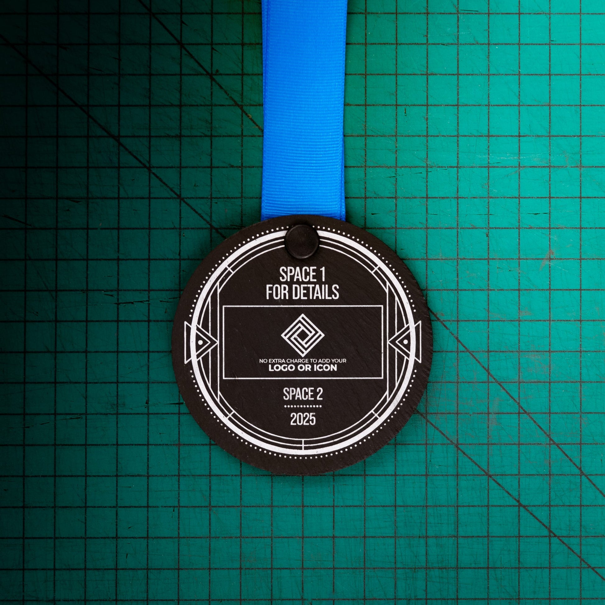 A personalised laser engraved Welsh slate sports medal