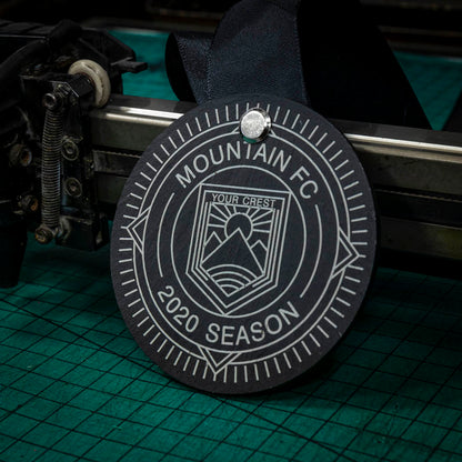 A personalised laser engraved Welsh slate running medal