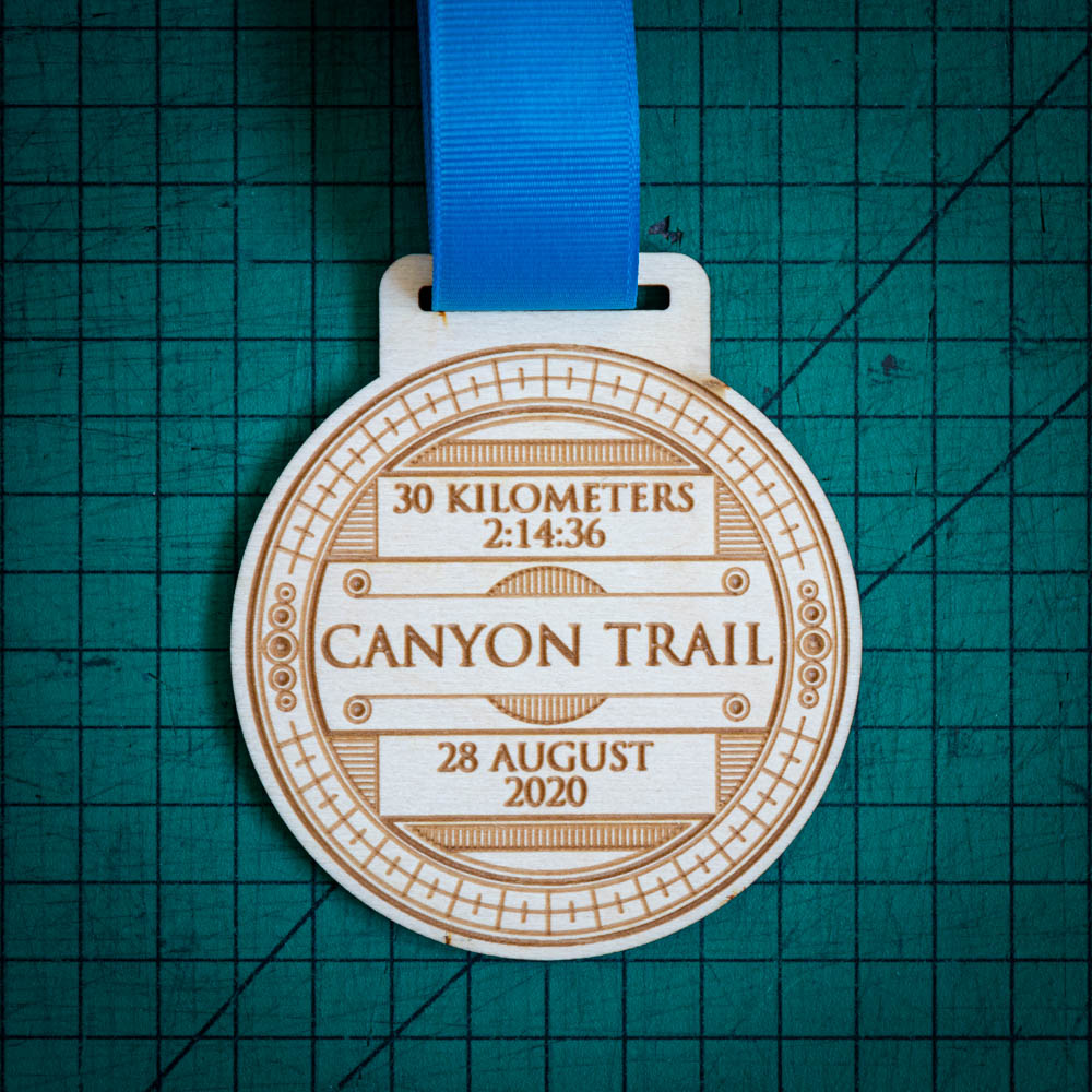 A laser engraved personalised Eco-friendly wooden medal
