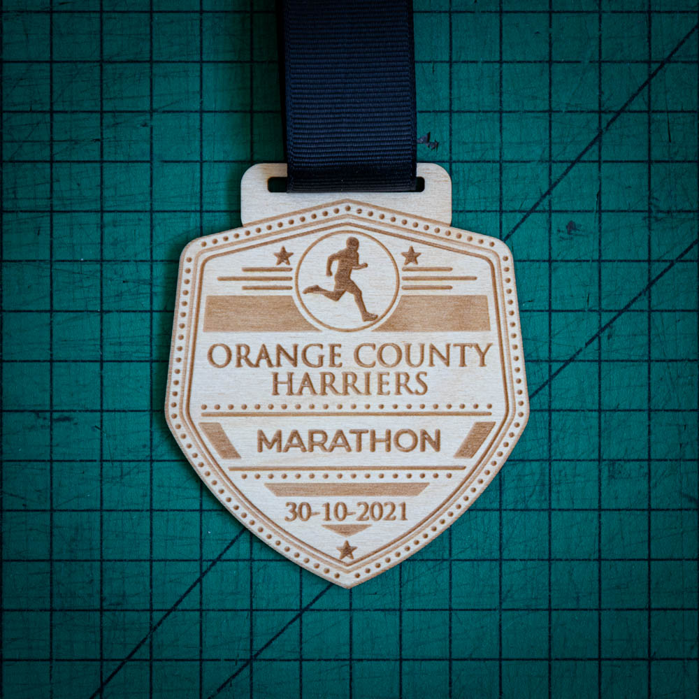 A laser engraved personalised Eco-friendly wooden medal